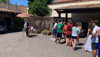 Youth observing the Sun spots and flares through a solar telescope