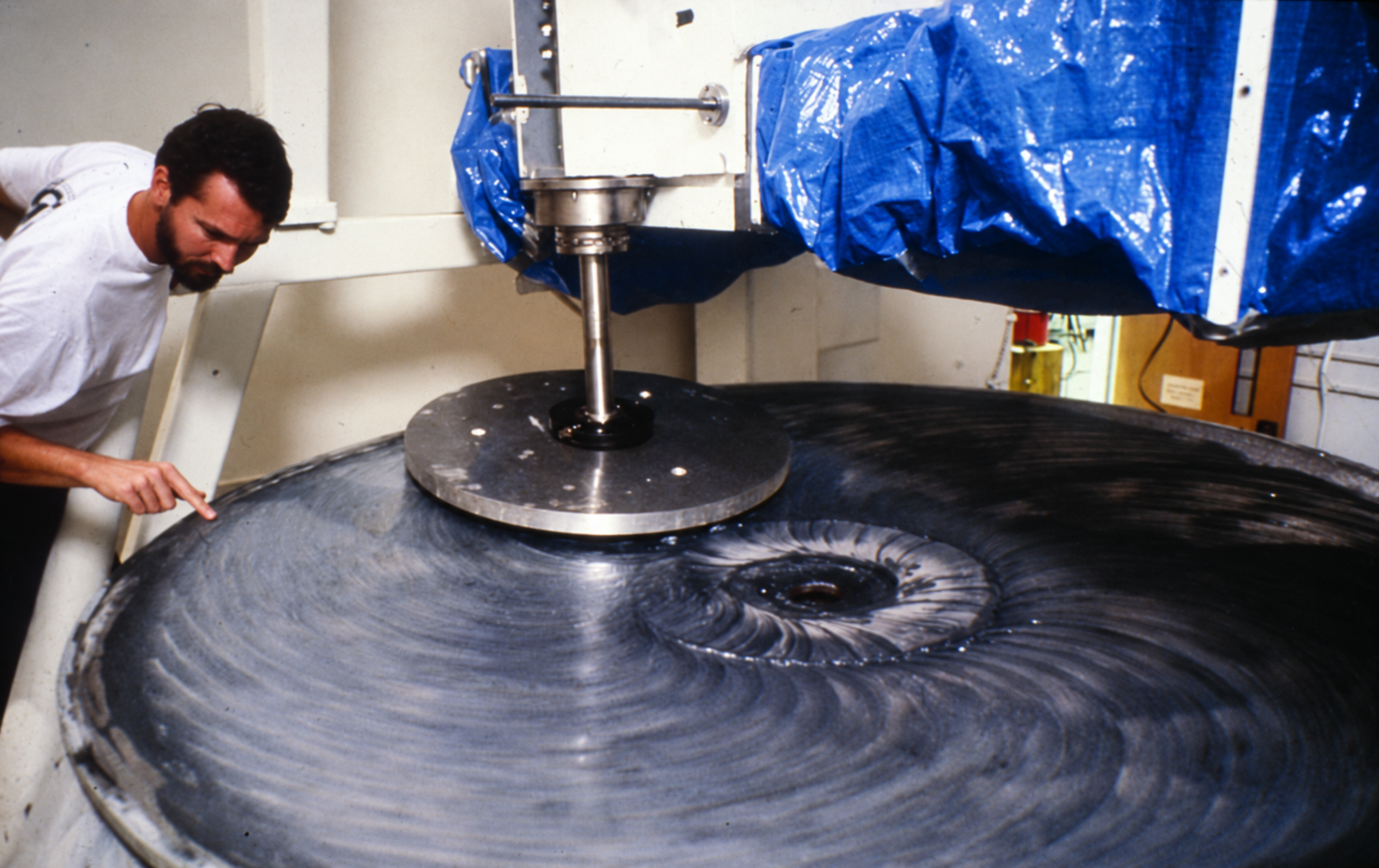 Buddy Martin inspecting the VATT mirror during polishing